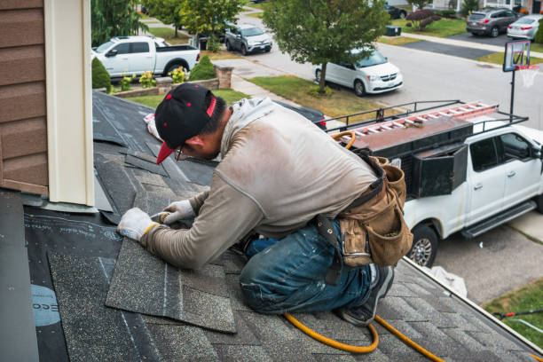 Professional Roofing technician working in Pine Knoll Shores, NC